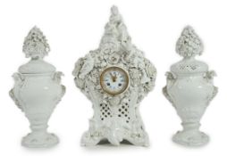 Vion & Baury - a 19th century German porcelain clock garniture, clock surmounted with a