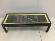 A Chinese ebonised table inset with a soapstone panel, width 132cm, depth 50cm, height 41cm.
