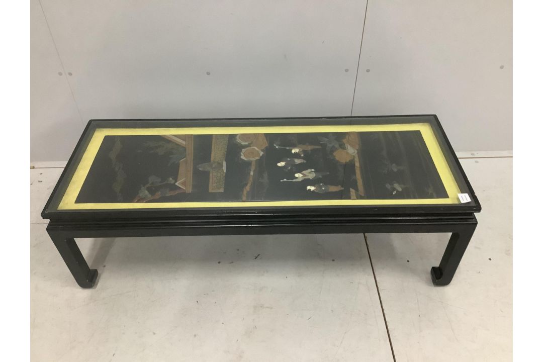 A Chinese ebonised table inset with a soapstone panel, width 132cm, depth 50cm, height 41cm. - Image 1 of 2