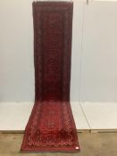 An Afghan red runner, 360 x 90cm. Condition - good