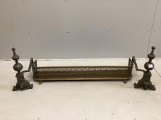 A pair of cast bell metal and wrought iron andirons, height 53cm, and a brass fender. Condition -
