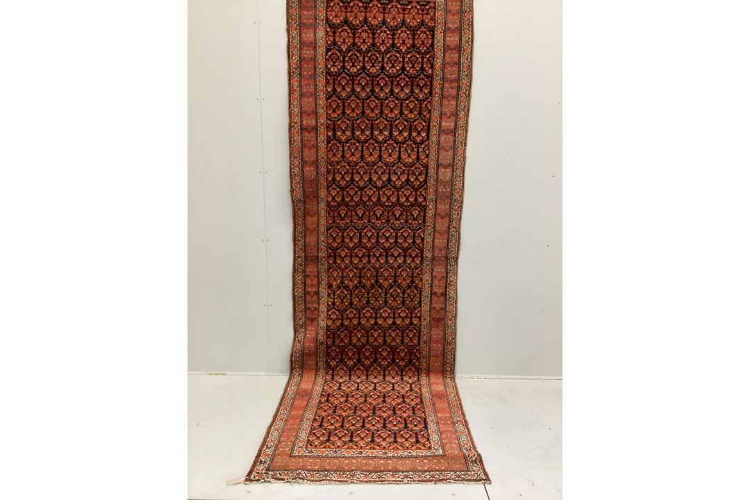 An Afshar blue ground runner woven with rows of floral devices, 354cm x 107cm. Condition - fair to - Image 1 of 2
