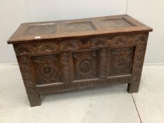 An 18th century carved oak coffer, width 117cm, depth 53cm, height 71cm. Condition - fair
