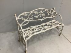 A Victorian Coalbrookdale style cast iron branch pattern garden bench, width 128cm, depth 50cm,