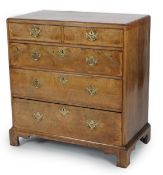 A George II walnut and feather banded caddy top chest, of two short and three graduated long