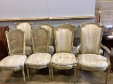 A harlequin set of eight French cream painted dining chairs, comprising a pair of carvers, four cane