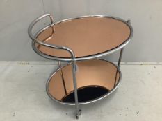 A mid century chrome and peach glass oval two tier drinks trolley, width 66cm, depth 47cm, height