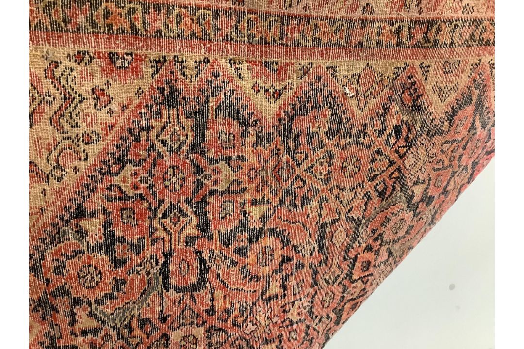 A Caucasian red ground rug, 192 x 129cm. Condition - faded and worn - Image 3 of 3