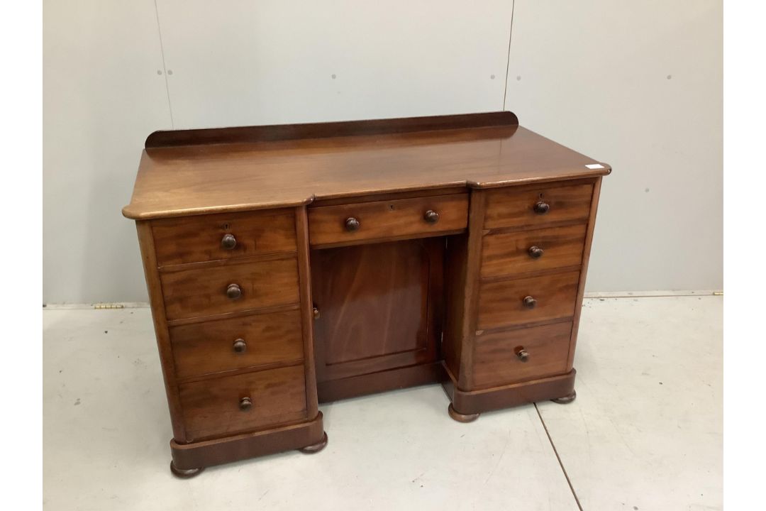 A Victorian mahogany kneehole desk, fitted nine small drawers, width 125cm, height 78cm. Condition - - Image 1 of 3