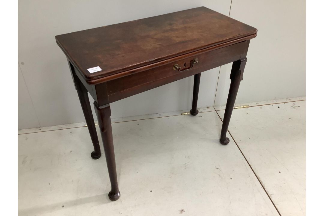 A George II mahogany folding tea table, width 81cm, height 73cm. Condition - fair to good - Image 1 of 2