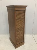 An early 20th century oak Lebus tambour filing cabinet, width 37cm, depth 49cm, height 116cm.