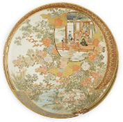 A Japanese Satsuma circular dish, Meiji period, painted with ladies and children in a pavilion