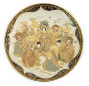 A Japanese Satsuma circular dish, Meiji period, painted with Kwannon, attendants, rakan and a