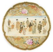 A Japanese Satsuma barbed rim dish, Meiji period, painted to a rectangular reserve with a procession