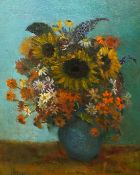 James Bolivar Manson (English, 1879-1945) Still life of sunflowers and other blooms in a blue