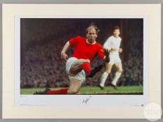 A large colour photographic print of Sir Bobby Charlton playing for Manchester United
