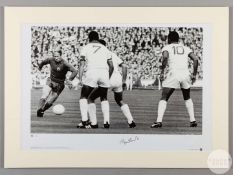 A large black and white photographic print of Sir Bobby Charlton