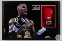 A Connor Benn boxing glove and photographic print montage.