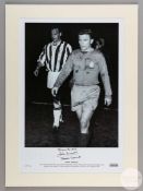 A large black and white photographic print of John Charles and Ferenc Puskas