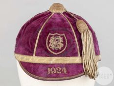 A purple velvet schools Cricket Cap