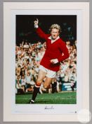 A large colour photographic print of Denis Law playing for Manchester United