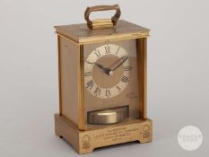 Viv Anderson a brass commemorative carriage clock with circular dial and Roman numerals