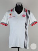 David McCreery white No. 12 Manchester United short sleeved 1977 FA Charity shield shirt.