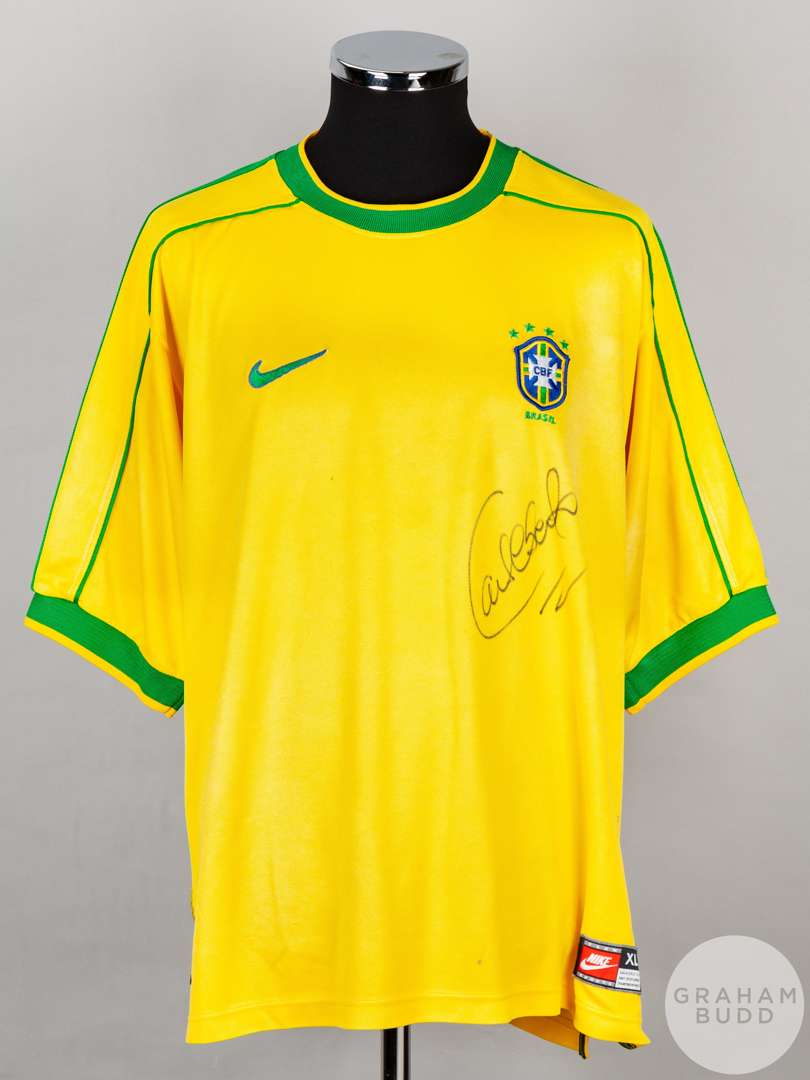 A yellow Brazil short sleeved replica shirt signed by Roberto Carlos.