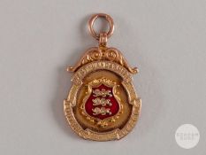 9ct gold and enamel West Lancashire Football League medal, 1922-23.