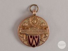 9ct gold and enamel West Lancashire Football League medal.