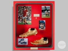 A pair of gold coloured cast football boots.