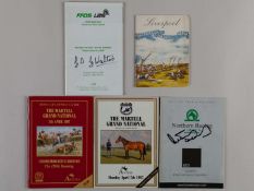 Four autographed racecards.