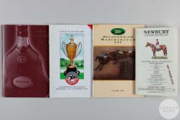 Four jumps racecards each signed by the competing jockeys.