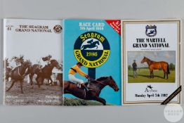 A trio of Grand National racecards each fully-signed by the competing jockeys.