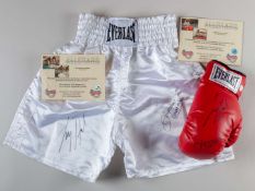 A pair of Everlast boxing shorts autographed by Larry Holmes and Ken Norton.