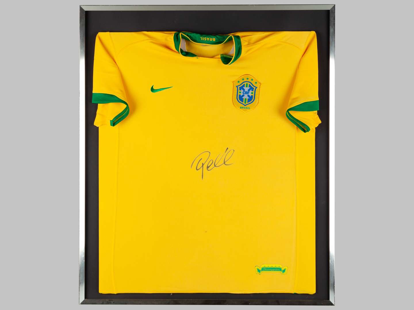 A yellow replica Brazil shirt autographed by Pele