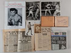 A boxing autograph book with autographs.