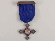 A silver 1914 Polytechnic Harriers Referee lapel badge.