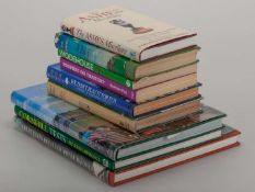 A collection of autographed cricket books.
