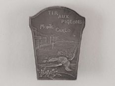 A white-metal pidge shooting lapel badge.