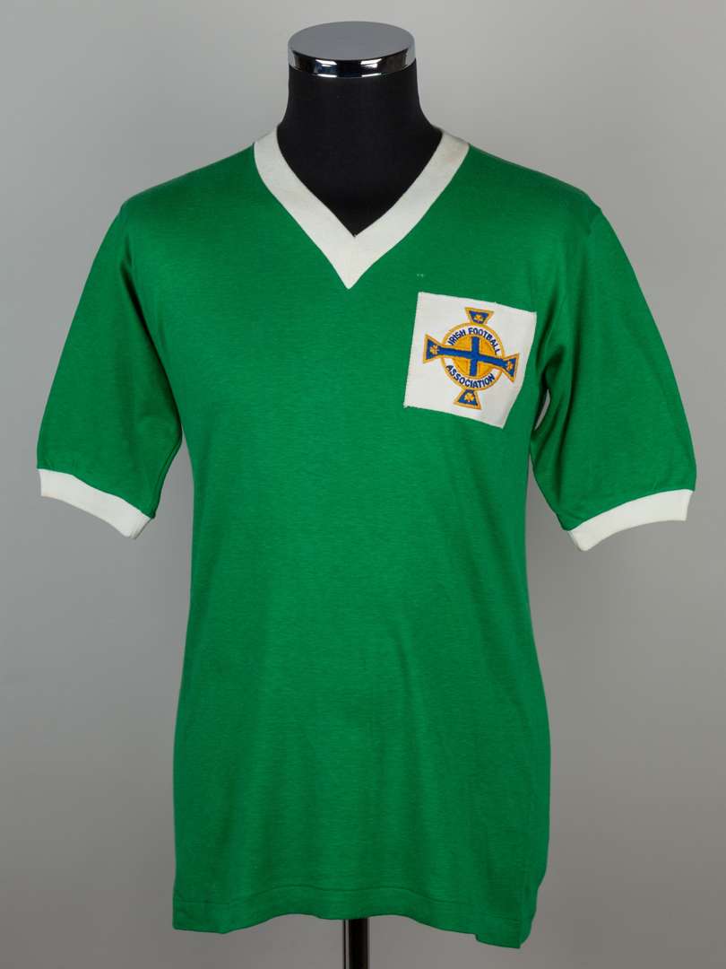 George Best green and white No.7 Northern Ireland match worn short-sleeved shirt, 1964.