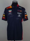 Red Bull racing 2019 replica polo shirt signed by Max Verstappen and Alex Albon.