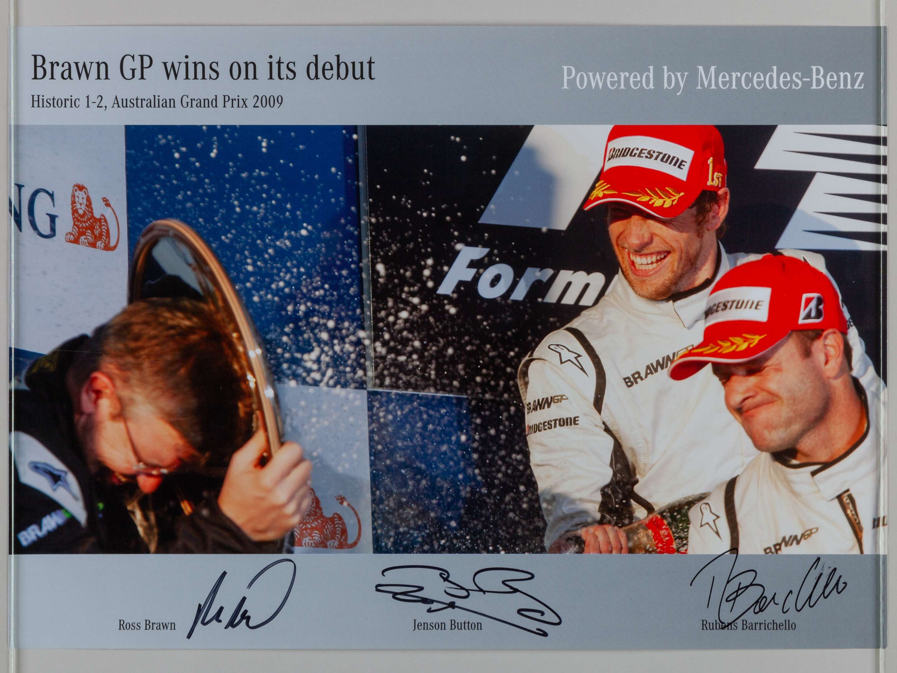 A signed Jenson Button, Rubens Barrichello and Ross Brawn poster.