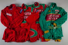 Three red Toyota race suits