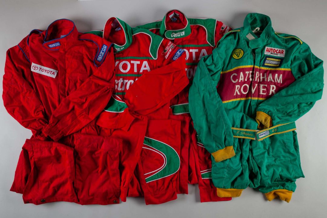 Three red Toyota race suits