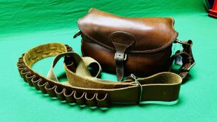 A GOOD QUALITY LEATHER CARTRIDGE BAG (12G) WITH CANVAS AND LEATHER SLING ALONG WITH A GOOD QUALITY