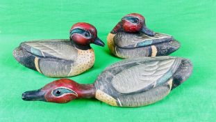 A HANDCRAFTED SET OF 3 DUCK 