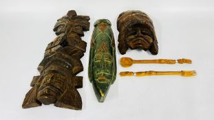A GROUP OF THREE CARVED ETHNIC MASKS.
