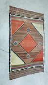 A PERSIAN FLAT WEAVE RUG WITH CENTRAL LOZENGE DESIGN 161CM X 286CM.