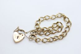 A 9CT GOLD BRACELET WITH SAFETY CHAIN AND PADLOCK CLASP.